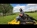 country mowing crazy overgrown grass in field and around pond cutting tall grass