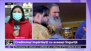 Credincioși fără mască și împărtășiți cu aceeași linguriță la ceremoniile religioase din Constanța