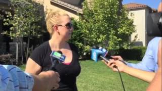 Woman visits memorial at site of apparent homicide