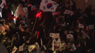 Crowds of supporters gather outside the residence of impeached South Korean President Yoon