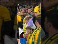 Socceroos goalie Maty Ryan gives his jersey to a fan while Martin Boyle trades with Jack Grealish