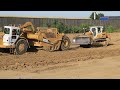 Scraperpushing with a little dozer