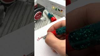 Benu Euphoria Christmas Twinkle fountain pen inked with Diamine Poinsettia