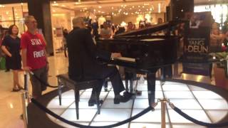 Uncle singing with pianist at The Curve Damansara Perdana