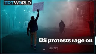 Trump threatens military force as protests rage