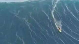 man surfing a tsunami