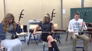 American students play the two-string fiddle