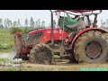 farming tractor machinery mudding tractor kubota m6040su 4x4 moving in muddy fields