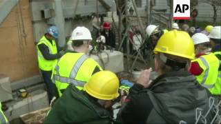 Crews worked carefully to remove a time capsule dating back to 1795 from the granite cornerstone of