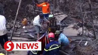 Rescuers in Vietnam try to save boy trapped in concrete pile