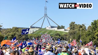 Thousands of anti-vaccine protesters march to Parliament House in Canberra