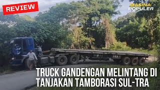 TRUCK GANDENGAN MELINTANG DI TANJAKAN TAMBORASI SULAWESI TENGGARA.