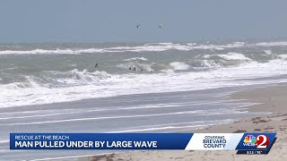 Bystanders rush into rough surf to save man pulled under by wave in Indialantic