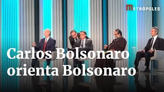 Carlos Bolsonaro dá orientações a Jair Bolsonaro antes do debate na Globo