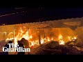 Gaza: tents engulfed by flames after Israeli airstrike next to al-Aqsa hospital