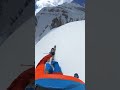 gnarly chute on skis with cliff at the end