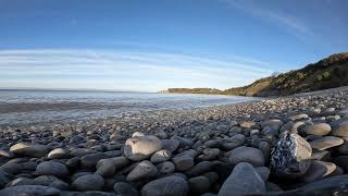 Gentle waves on a cobble beach