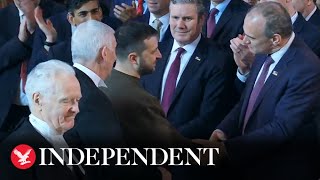 Zelensky shakes MPs hands after parliamentary address