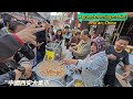 A huge morning market in Xi'an, China, with customers rushing to buy street food, a lively scene/4k