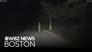 Dashcam video shows "suspicious" person in mask walk into the road in Hopkinton
