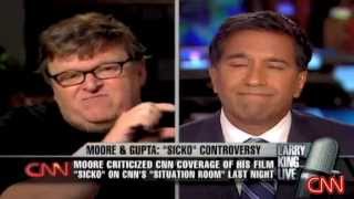 Michael Moore has a heated debate with CNN's Doctor Gupta on Larry King