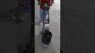 HTG 250 variable speed floor grinder with CW-1 #30 disk at Malad parking lot by OFC team