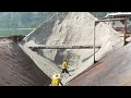 Barge unloading white sand in hot weather - Ying1