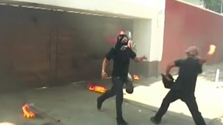 Raw: Protesters Hurl Fire-bombs at Govt Building