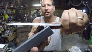 sharpening a serrated bread knife with a simple bench stone