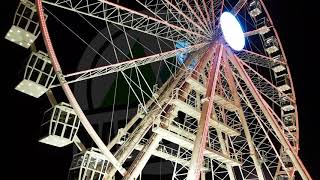 Royalty Free spinning ferris wheel ride illuminated against night sky [ 4k video ]