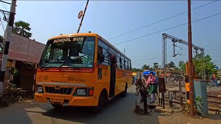 Fright Train Crosses In A Busy Railgate And School Bus Stuck And Watching Students Very Tired