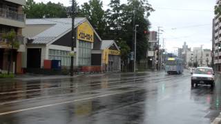 函館市電　Japan Hakodate City Tram ( Street Car ) 8008 with spark in the rain