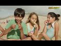 children playing with sand on the beach