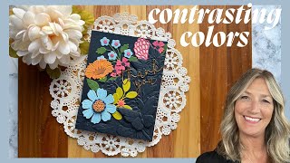 A Stark Contrast in Color makes for a beautiful Vivid Floral Card! #cardmaking #embossingfolder