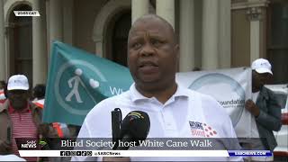 Blind society host white cane walk