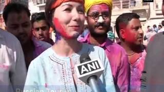 Foreign tourists play Holi in Varanasi