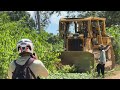 stressful caterpillar d6r xl bulldozer builds rocky road over mountain