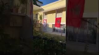 The flag of Turkish-occupied Cyprus is displayed outside a house in Athens!