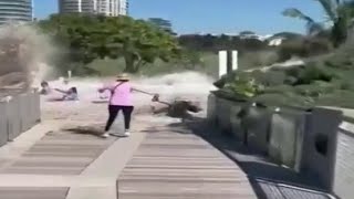 Video shows massive waves sweeping up people walking along South Beach boardwalk