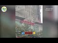 changsha apartment building catches fire two women climb out a window to escape women fire china