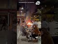 french diners sit with wine despite raging protest fire