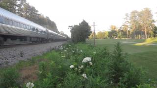 Amtrak 02E passes the track machines working real late!