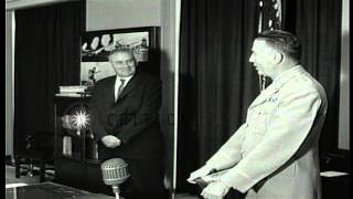 Assistant Secretary of Army Hugh M Milton III shows plaque to others received for...HD Stock Footage