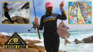 What a catch! Fishing from the rocks in Oyster Bay, South Africa.