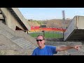 FlyONE=FlyLAST. THE GOAT of Sports Travel Explains at a Armenia Football Stadium