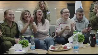 Families of released Israeli hostages react as they are handed over to IDF forces from the Red Cross