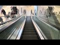 espoo finland. 2x kone escalator ride at sello shopping mall inside a clothes shop