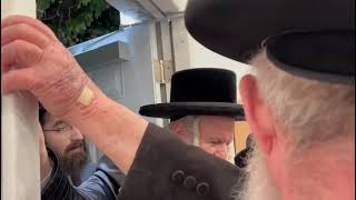 Bobov Rebbe Affixes a Mezuzah in Florida