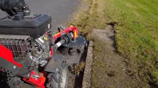 Kersten UBS hydro with WBK 50 Weedbrush clearing moss, grass and weeds from kerb edge