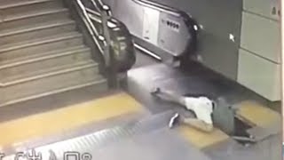 Woman fall through through broken floor tile at subway escalator